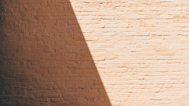 Brick wall skateboard shadow minimalist free wallpaper - medium preview image