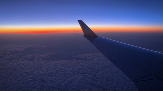 Plane wing sunset ocean horizon free wallpaper - medium preview image