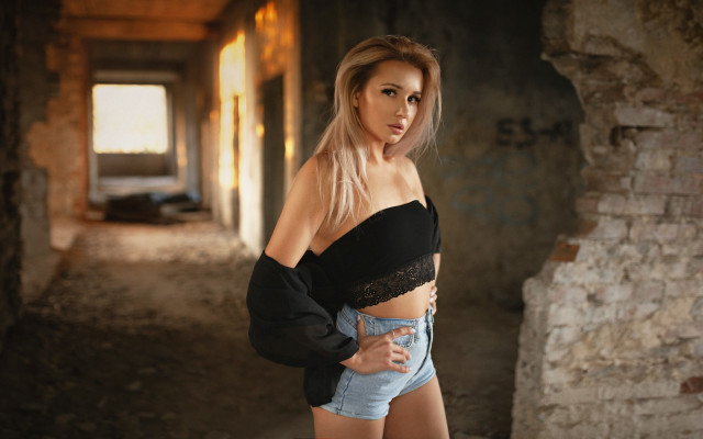 Blonde woman denim shorts brick free wallpaper - medium preview image