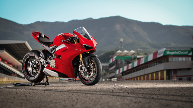 Red motorcycle mountain road building free wallpaper - medium preview image