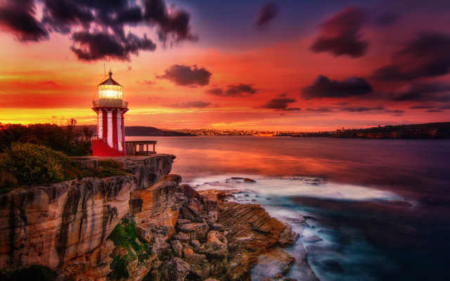 Lighthouse cliff ocean sunset mystical free wallpaper - medium preview image