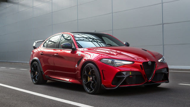 Red sports car driving street free wallpaper - medium preview image