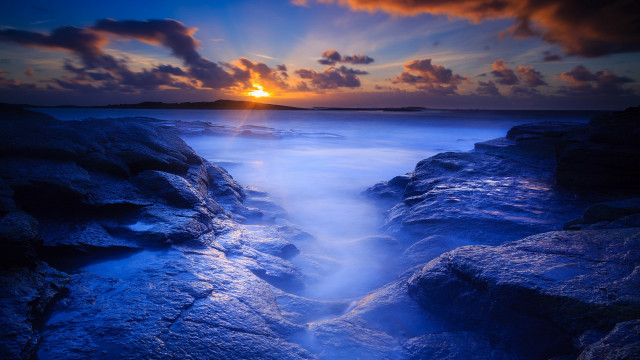 Sunset rocky beach water island free wallpaper - medium preview image