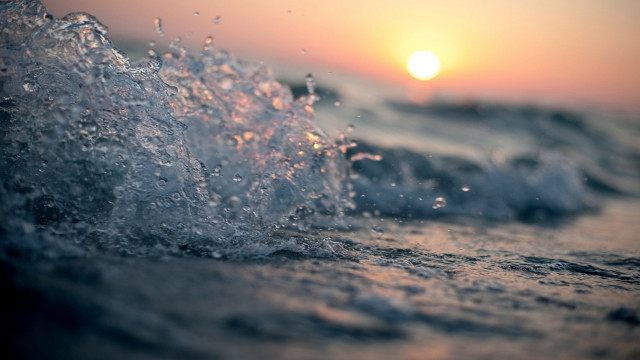 Wave breaking beach sunset ocean free wallpaper - medium preview image