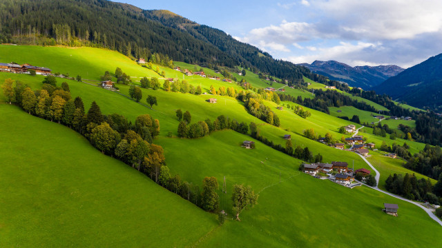 Green valley village mountains clouds free wallpaper - medium preview image