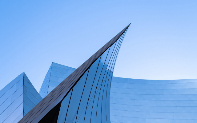 Curved building blue sky plane free wallpaper - medium preview image