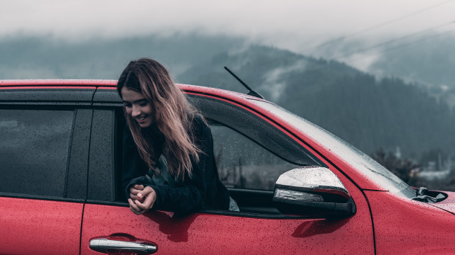 Woman red car window smiling free wallpaper - medium preview image