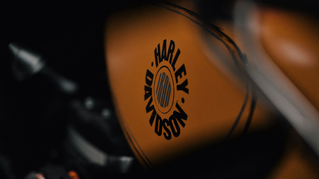 Motorcycle logo closeup black background free wallpaper - medium preview image