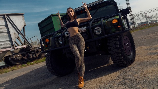 Woman black top camouflage pants free wallpaper - medium preview image