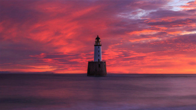 Lighthouse water cloudy sunset mountain free wallpaper - medium preview image