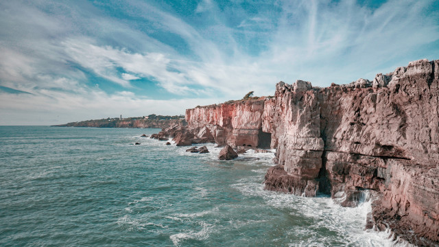 Rocky cliff water mountain sky free wallpaper - medium preview image