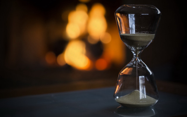 Hourglass sand table fireplace blurry free wallpaper - medium preview image
