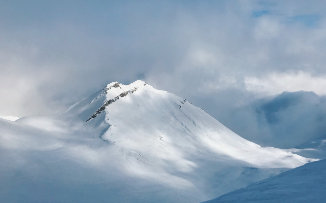 Snow mountain skier clouds matte free wallpaper - medium preview image