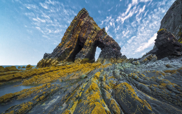 Mossy rock bridge lake sky free wallpaper - medium preview image