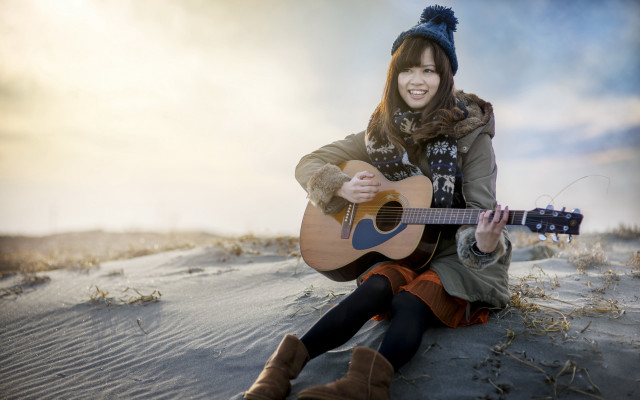 Woman sitting guitar beach smiling free wallpaper - medium preview image
