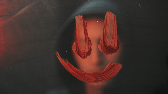 Red face black surface smile free wallpaper - medium preview image