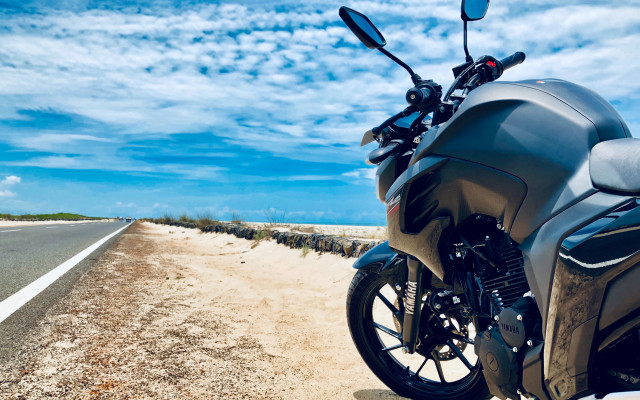 Motorcycle beach road blue sky free wallpaper - medium preview image