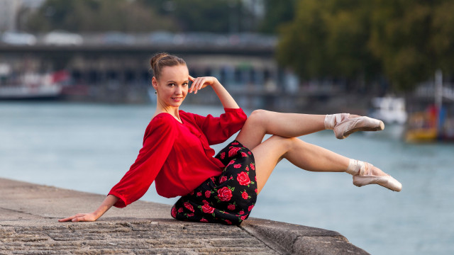 Woman red shirt sitting wall free wallpaper - medium preview image