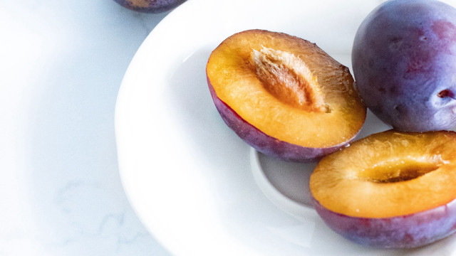 Plums halved whole table white free wallpaper - medium preview image