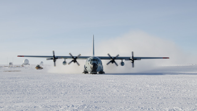 Plane landing snowy runway dust free wallpaper - medium preview image
