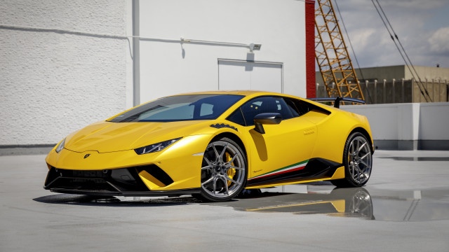 Yellow sports car building crane free wallpaper - medium preview image