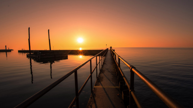 Sunset pier person anamorphic flare free wallpaper - medium preview image
