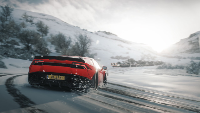 Red sports car snowy mountains #2 free wallpaper - medium preview image