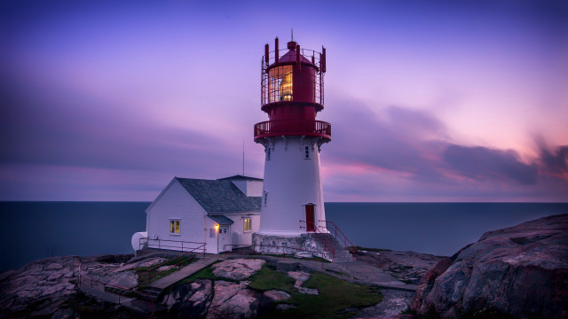 Lighthouse rocky shore purple sky free wallpaper - medium preview image
