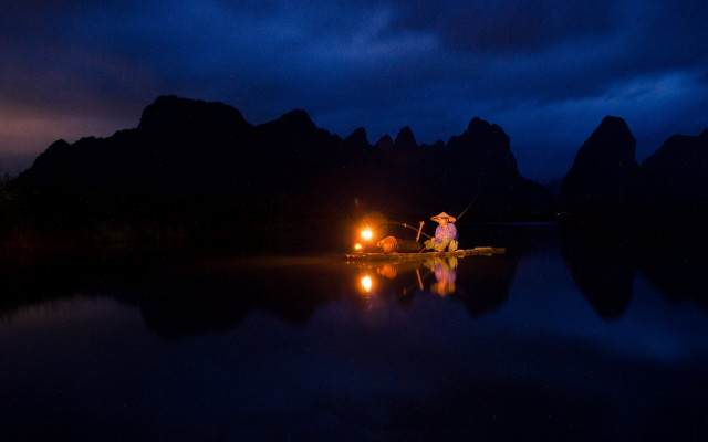 Man boat night flashlight tent free wallpaper - medium preview image