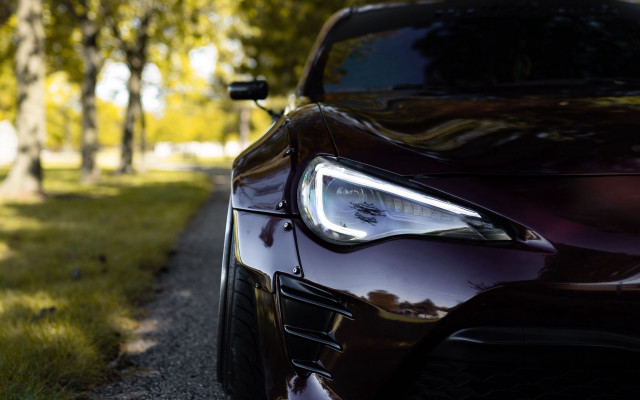 Car closeup road treeline grass free wallpaper - medium preview image