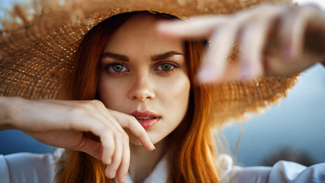 Woman hat pointing blurry portrait free wallpaper - medium preview image