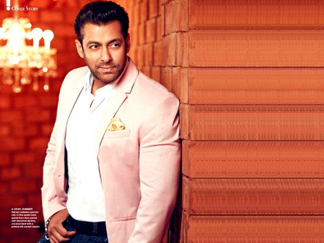 Man pink suit leaning wall free wallpaper - medium preview image