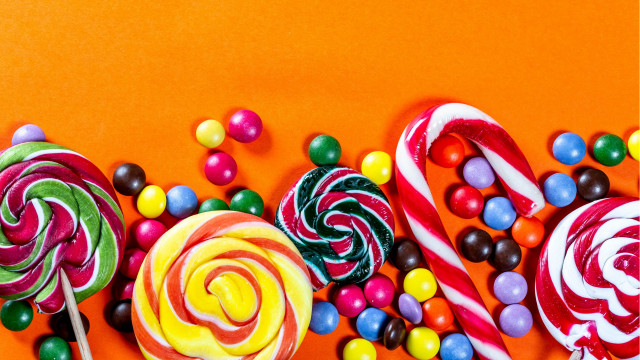 Candy lollipops orange background maximalism free wallpaper - medium preview image