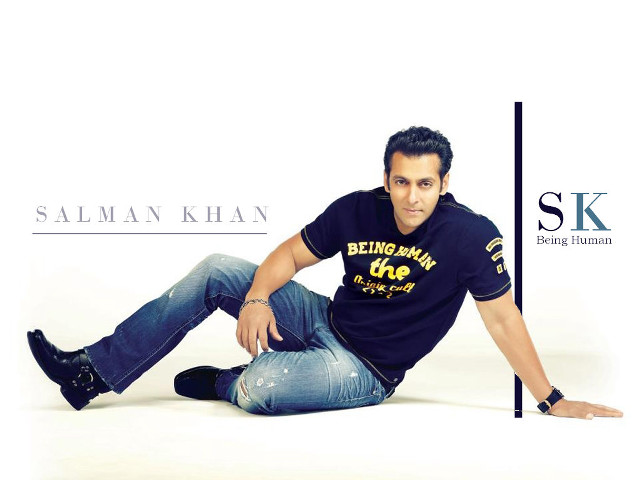 Man sitting crossed jeans black free wallpaper - medium preview image