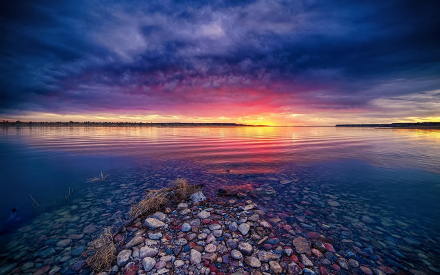 Sunset water rocks cloudy sky free wallpaper - medium preview image