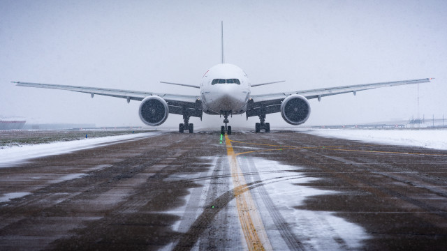 Large jetliner snowy runway tilt free wallpaper - medium preview image