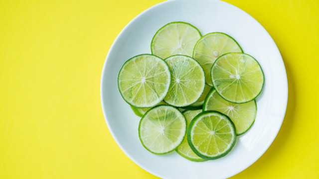 Sliced limes yellow background white free wallpaper - medium preview image