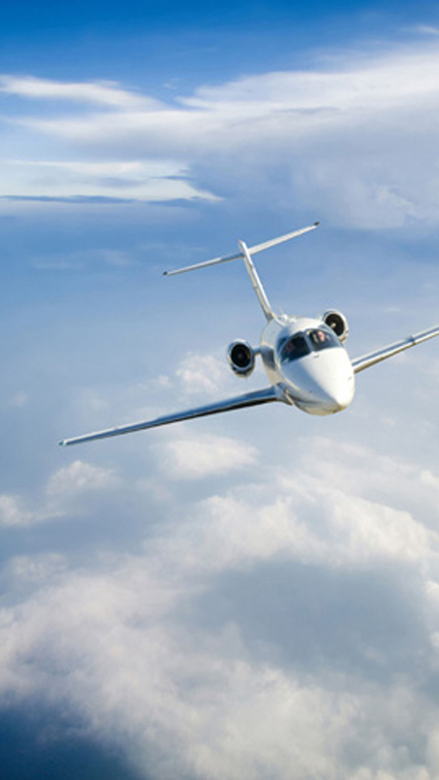 Jetliner flying blue cloudy sky free wallpaper - medium preview image
