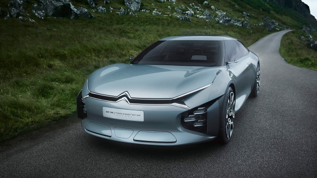 Silver car driving green hillside free wallpaper - medium preview image