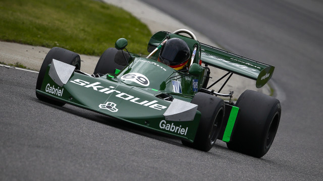 Green racecar racetrack grass person free wallpaper - medium preview image