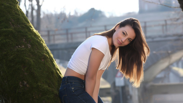 Woman leaning tree bridge city free wallpaper - medium preview image
