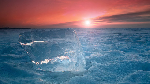Ice sculpture sunset mountains ocean free wallpaper - medium preview image