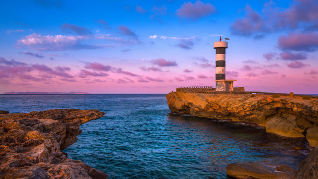 Lighthouse cliff ocean sunset pink free wallpaper - medium preview image