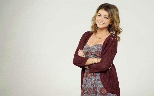 Woman smiling crossed arms floral free wallpaper - medium preview image
