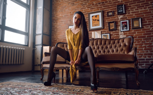 Woman couch brick wall yellow free wallpaper - medium preview image