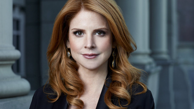 Red haired woman serious portrait free wallpaper - medium preview image