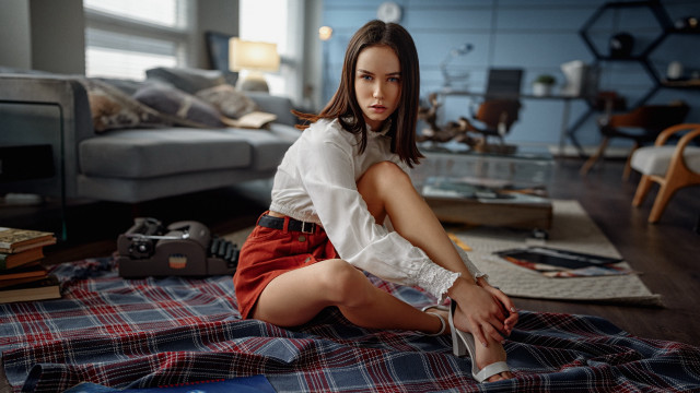 Woman sitting bed plaid couch free wallpaper - medium preview image