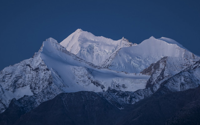Snowy mountain dark sky clouds free wallpaper - medium preview image