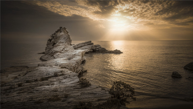 Rock formation sunset ocean shore free wallpaper - medium preview image