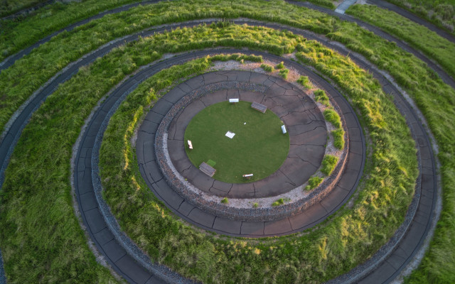 Circular grassy area lawn building free wallpaper - medium preview image